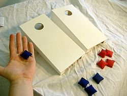 Tabletop Cornhole Game with Red and Black Bags